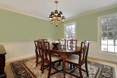 Dining room in suburban home with floral carpet