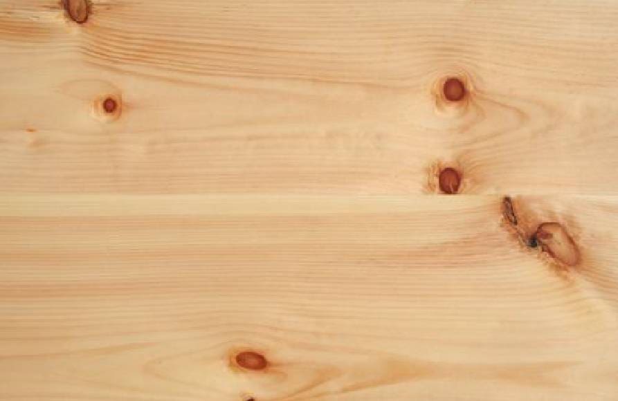 A close up of the wood grain on a table.