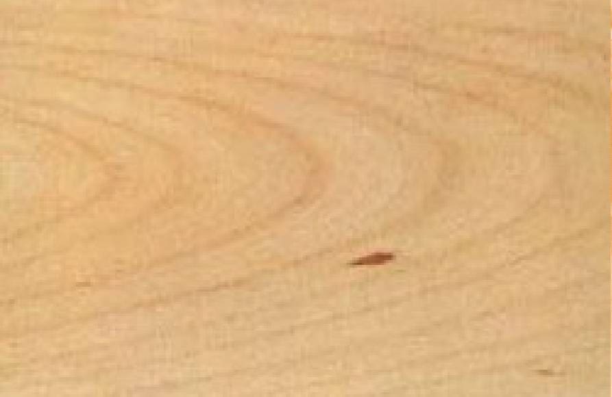 A close up of the wood grain on a table.