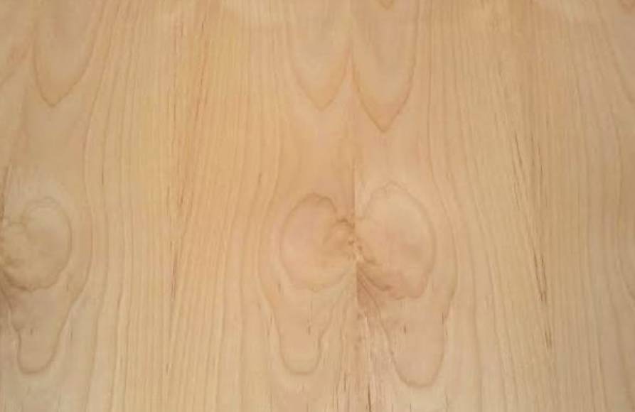 A close up of the wood grain on a table.