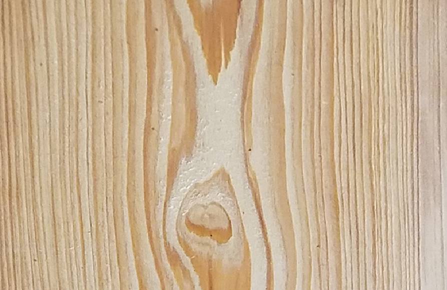 A close up of the wood grain on a wooden surface.